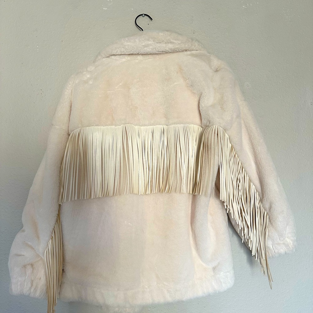 Fur jacket with tassels